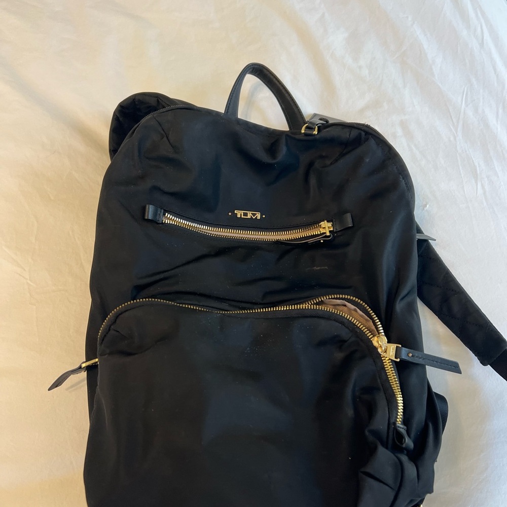 Tumi Black Backpack with Gold Accents